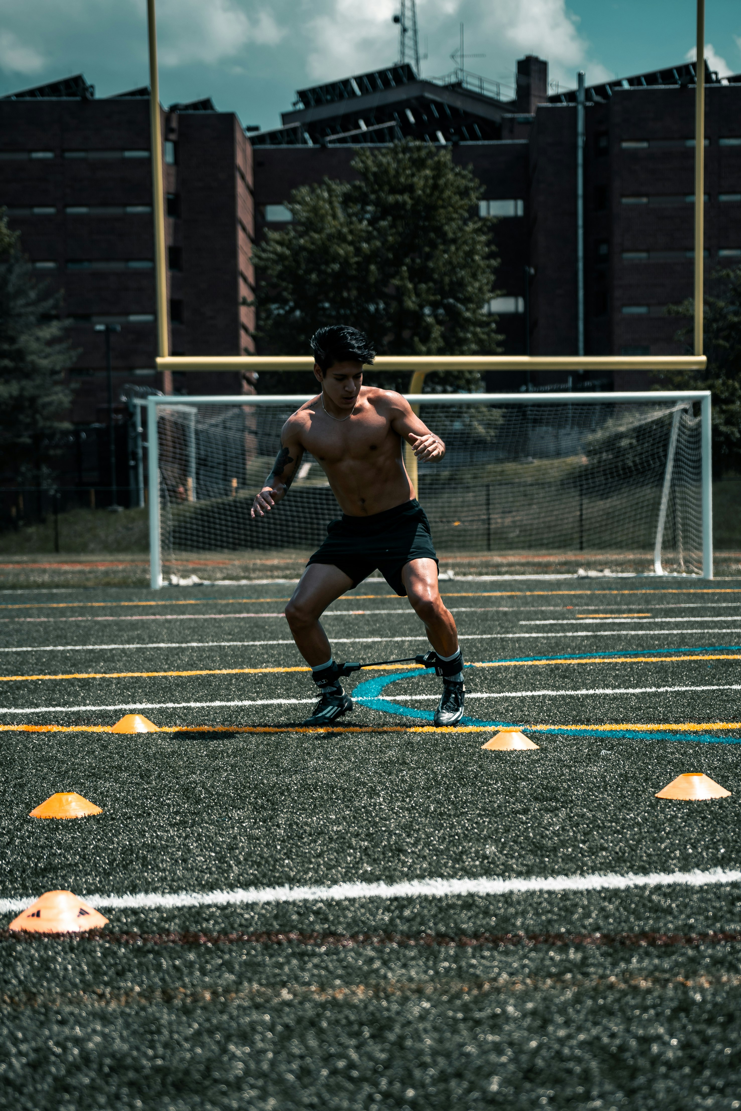 man in black shorts playing basketball during daytime